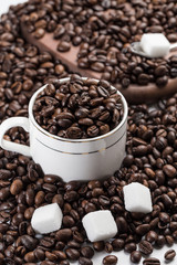 Coffee beans and sugar cubes