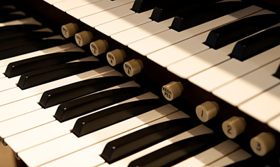 Two manuals on a large pipe organ.
