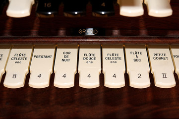 Stops on a large pipe organ.