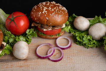 ready burger to eat with mushrooms and cheese, red onion and fried champignons