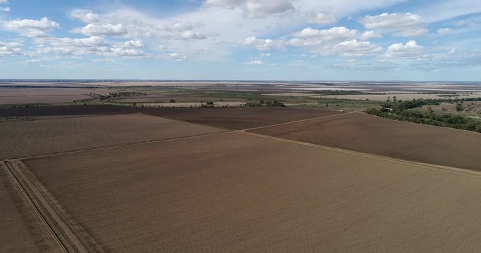 Cultivated plowed black soil of artesian basin on rural agricultural farm near Moree regional town in Narrabri shire seen from above.