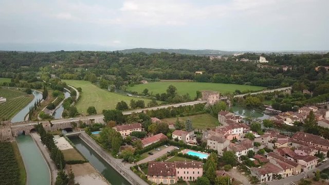 Valeggio sul Mincio aerial view of the Borgo famous Visconti bridge over the river and medieval Gothic castle