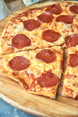 Slice of hot pizza large cheese lunch or dinner crust seafood meat topping sauce. with bell pepper vegetables delicious tasty fast food italian traditional on wooden board table classic in view