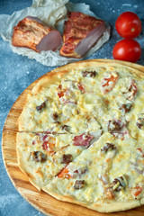 Slice of hot pizza large cheese lunch or dinner crust seafood meat topping sauce. with bell pepper vegetables delicious tasty fast food italian traditional on wooden board table classic in view