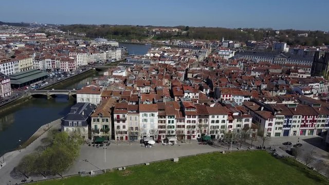 Bayonne aerial view of the medieval typical French houses along the Nive river in France on a sunny day with blue sky
