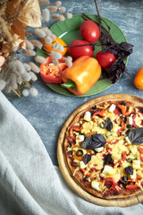 Slice of hot pizza large cheese lunch or dinner crust seafood meat topping sauce. with bell pepper...