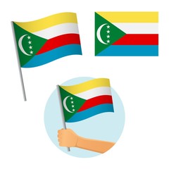 Comoros flag in hand