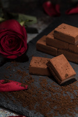 Chocolates and roses on the table