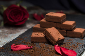 Chocolates and roses on the table
