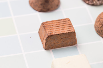 Chocolates and roses on the table