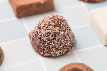Chocolates and roses on the table