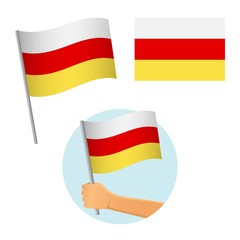 south ossetia flag in hand