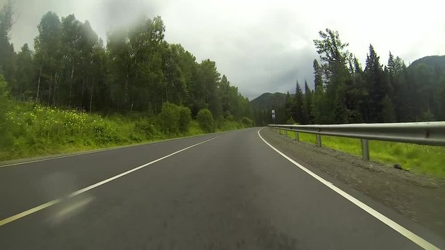 A trip by car on a mountain serpentine 