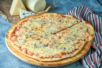 Slice of hot pizza large cheese lunch or dinner crust seafood meat topping sauce. with bell pepper vegetables delicious tasty fast food italian traditional on wooden board table classic in view