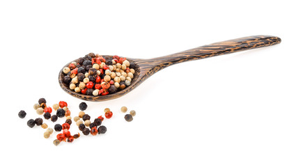 dried peppers in wood spoon isolated on white background