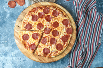 Slice of hot pizza large cheese lunch or dinner crust seafood meat topping sauce. with bell pepper vegetables delicious tasty fast food italian traditional on wooden board table classic in view