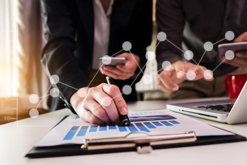 Co working team meeting concept: Business woman working and studying together with tablet document graph paper in office, discuss finance and marketing solution reporting file in working place.