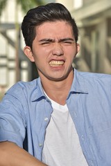 Obraz premium A Stressed Asian Male