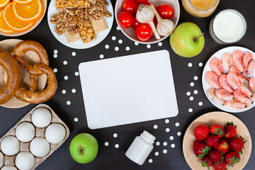 Set of allergic products as milk, oranges, tomatoes, garlic, shrimp, peanuts, eggs, apples, bread, strawberries