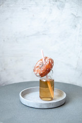 Finnish traditional Vappu food 1st of May, sugar donuts with sima on marble background with copy space