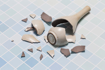 The vase broke on the floor