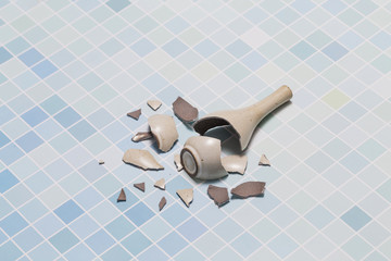 The vase broke on the floor