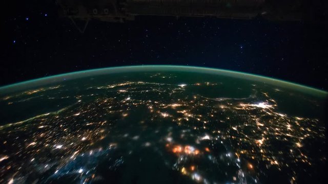 Planet Earth seen from the space with Northern and Southern Lights time lapse view