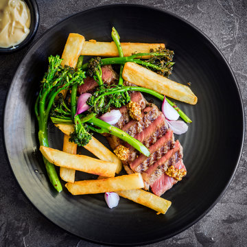 Steak and Chips with Broccolini Mustart Shallots and Bernaise Sauce Top View