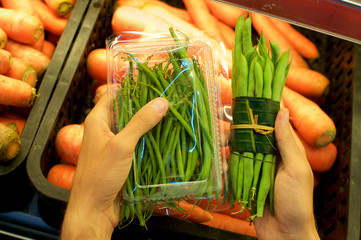 Vegetable wrapped in banana leaves vs. plastic packaging
