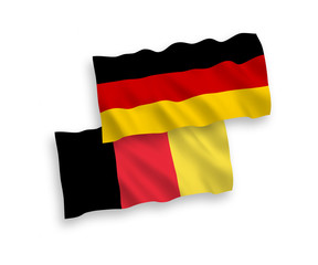 National vector fabric wave flags of Germany and Belgium isolated on white background. 1 to 2 proportion.