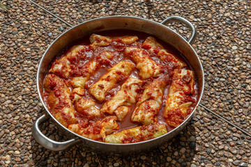 Cabbage rolls stuffed with rice and tomato sauce