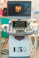 Interior of hospital room with ultrasound machine. Interior of examination room with ultrasonography machine in hospital. vertical photo