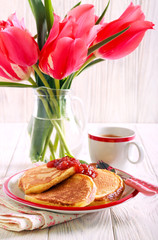 Pancakes with  jam served on plate