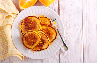 Orange scotch pancakes served on plate