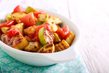 Fried zucchini and tomato