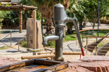 Old style vintage hand pump for water