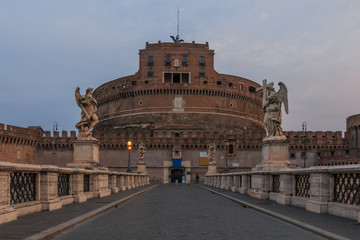 Castle Sant Angelo with the Aurelius bridge in the morning at dusk. Stone bridge with figures over...