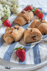 Homemade fresh golden croissants with chocolate filling