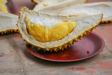 Durian riped and fresh, durian peel with yellow color on southeast Asian yard background