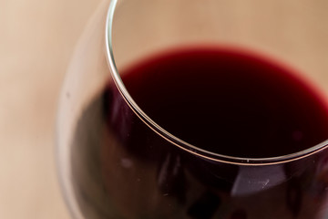 Circle wineglass macro still detail with red wine blurry on the background
