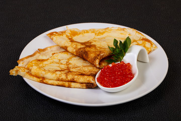 Pancake with red caviar