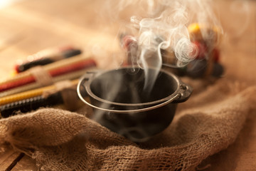 Witches pot with burning herbs
