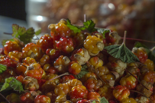 Сloudberriy berries in the spoon on the stone