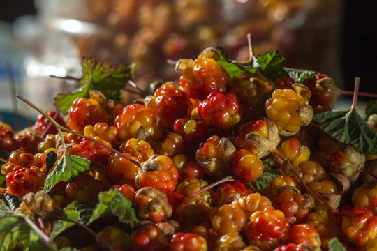 Сloudberriy berries in the spoon on the stone