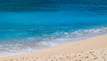 Fototapeta na wymiar white sand beach and clean blue sea