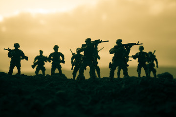 War Concept. Military silhouettes fighting scene on war fog sky background, World War Soldiers...