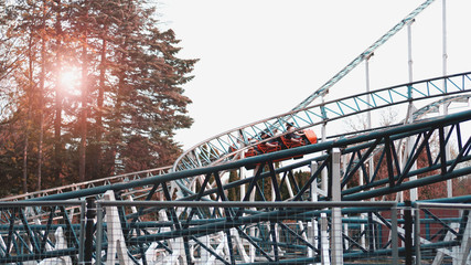 Naklejka premium A Colorful Looping Roller Coaster On A Beautiful Sunny Day