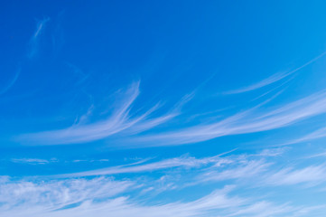 Blue sky with white cirrus clouds sunny panorama.