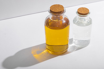 glass bottles with cork lids on a white background, side view