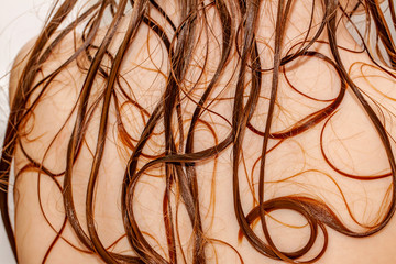 Close up of little girls wet hair in bath tube